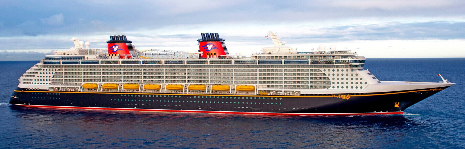 Pictured here is the Disney Fantasy, the fourth ship in Disney’s fleet launched in 2012. The Disney Fantasy continues the Disney Cruise Line tradition of blending the elegant grace of early 20th century transatlantic ocean liners with contemporary design and spectacular Disney entertainment.